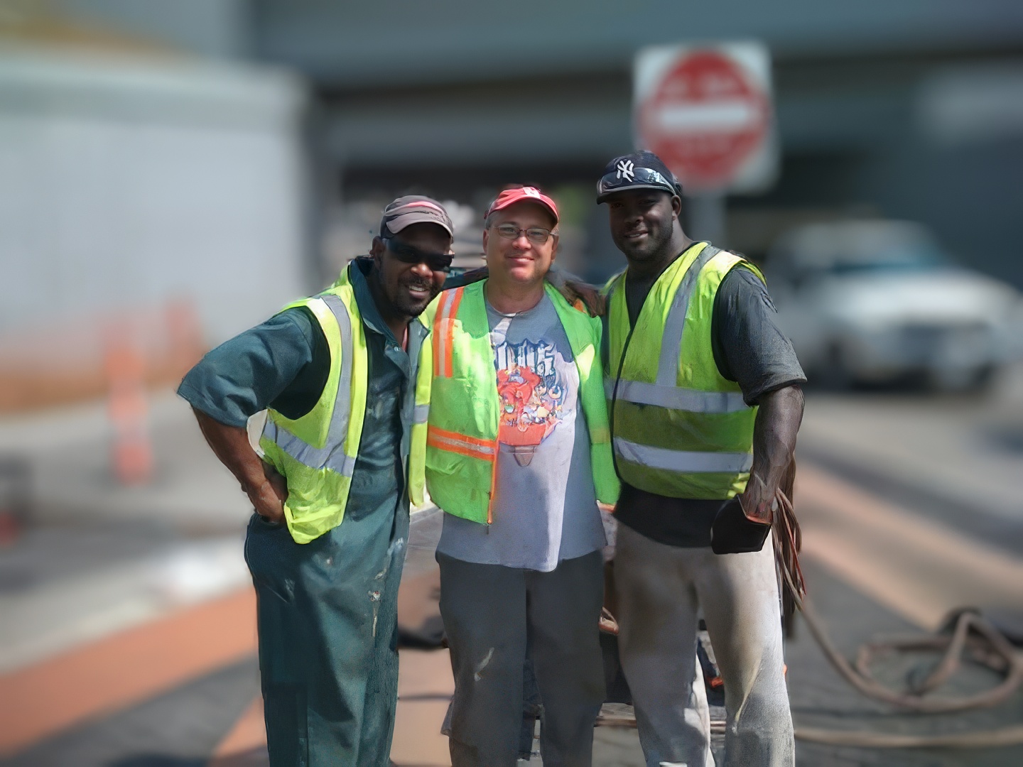 Steve Beavers standing with crew members on a project site