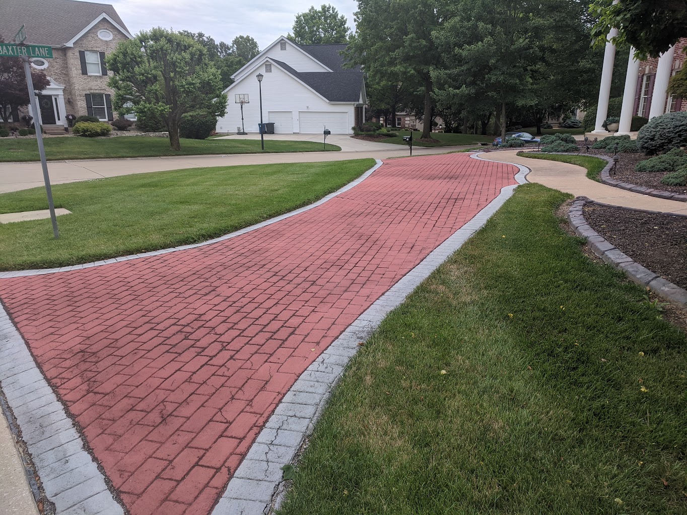 Worn residential driveway before restoration