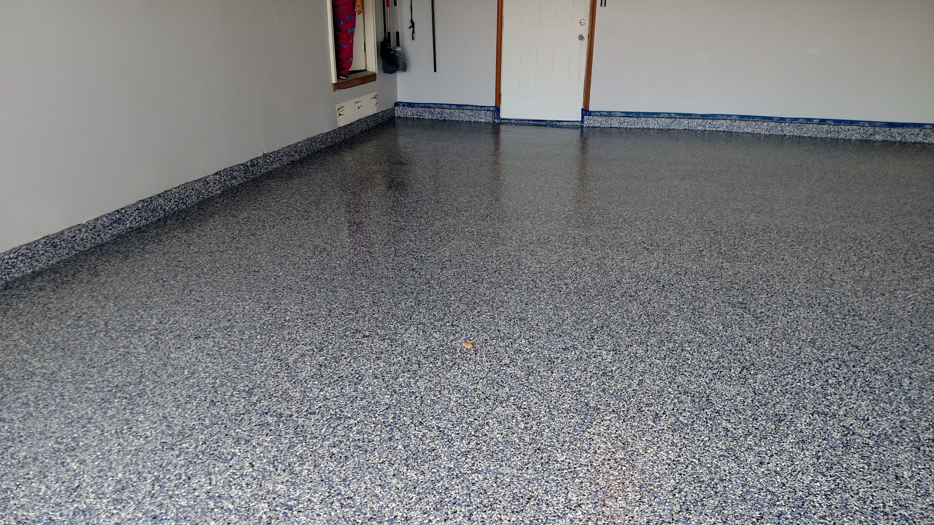 Epoxy coated garage floor with a clean, glossy finish